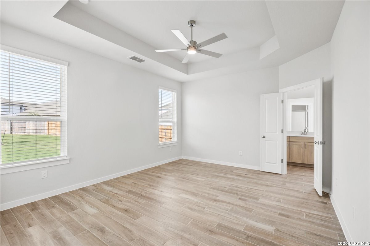 142 Stream Street Seguin, TX 78155 - Photo 10 of 20 wooden floor in an empty room with a window