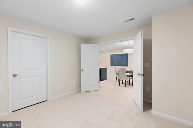a view of a livingroom with a furniture and chandelier fan