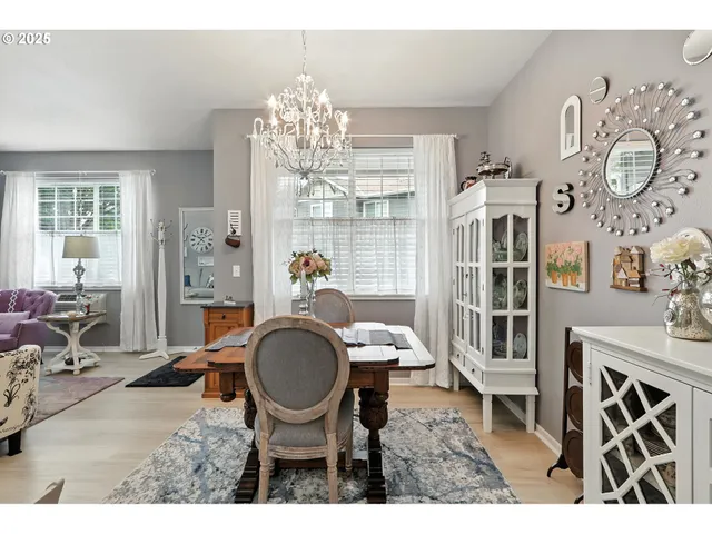 a kitchen with stainless steel appliances granite countertop a sink a stove and a microwave