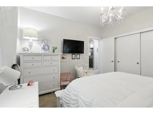 a bathroom with a granite countertop sink toilet mirror vanity and shower
