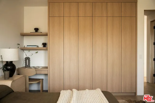 a bedroom with a bed and a cabinets