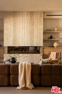 a living room with a couch and a window