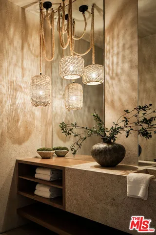 a table with a vase and flowers on it