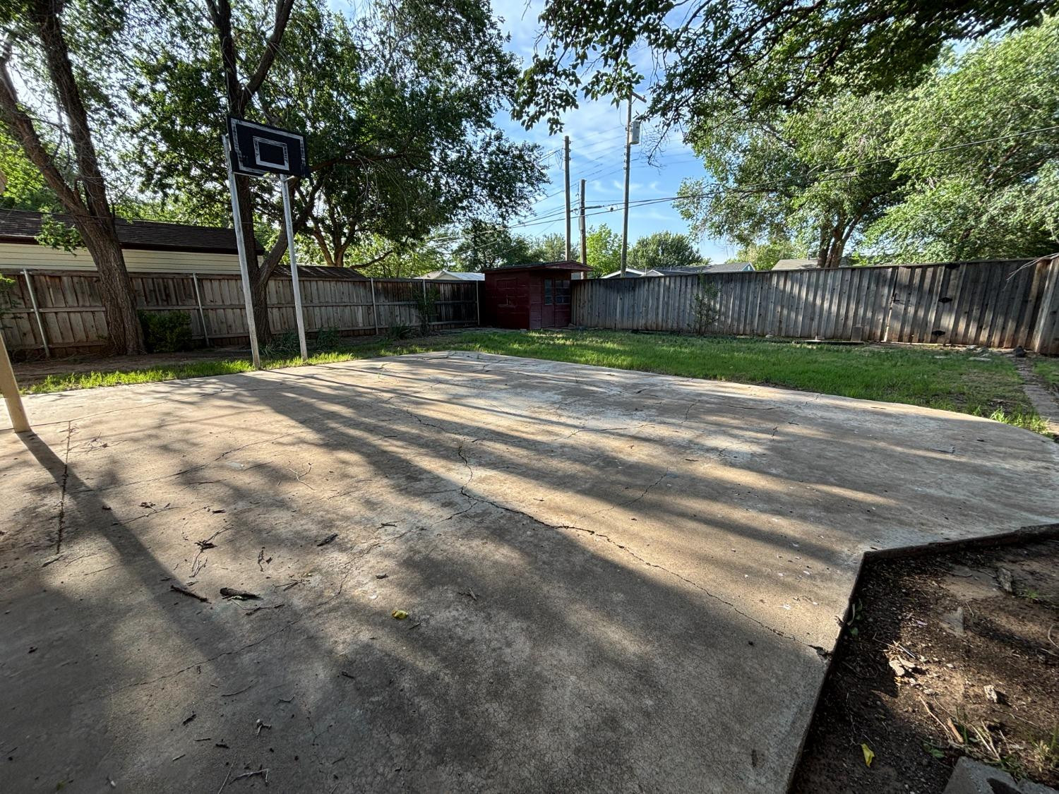 2825 24th Street Lubbock, TX 79410 - Photo 16 of 16 a view of a yard with wooden fence