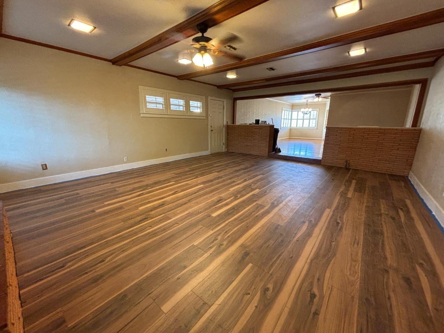 2825 24th Street Lubbock, TX 79410 - Photo 4 of 16 a view of empty room with wooden floor