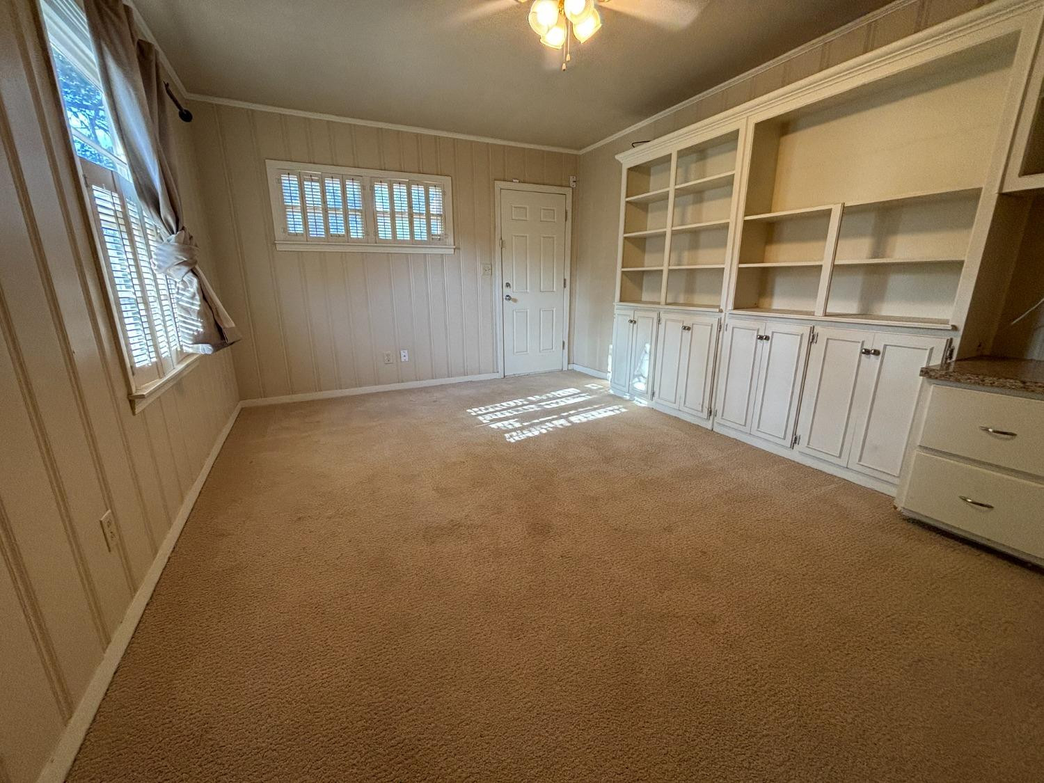 2825 24th Street Lubbock, TX 79410 - Photo 9 of 16 a view of an empty room with a window
