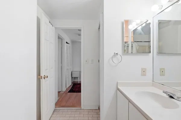a bathroom with a sink and mirror