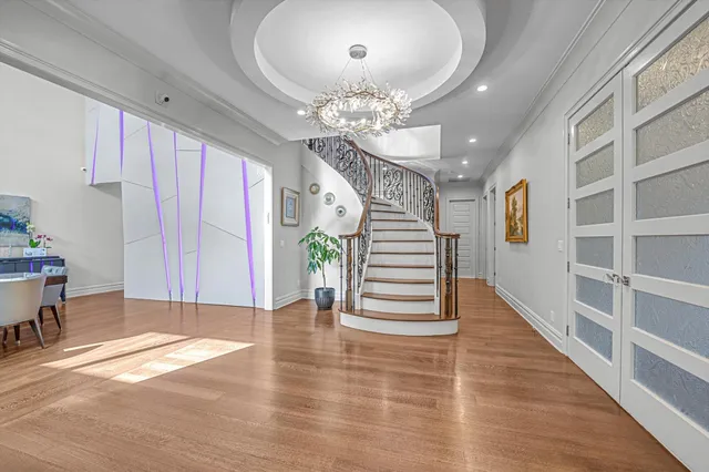 a view of entryway with wooden floor and window