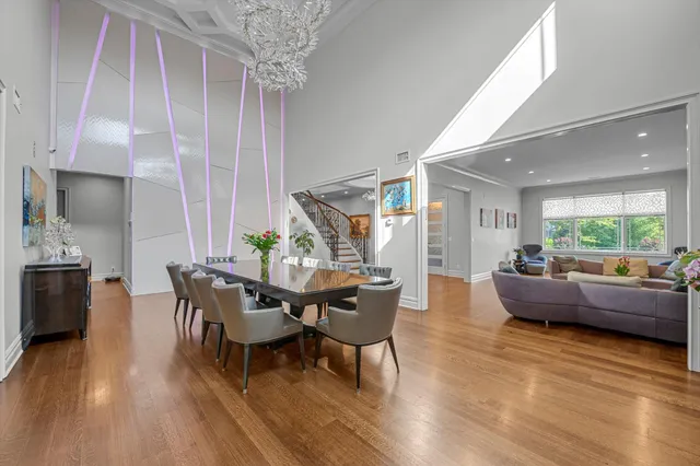 a dining room with furniture and wooden floor