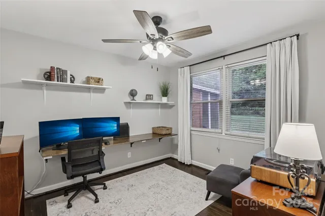 a work room with furniture and a window