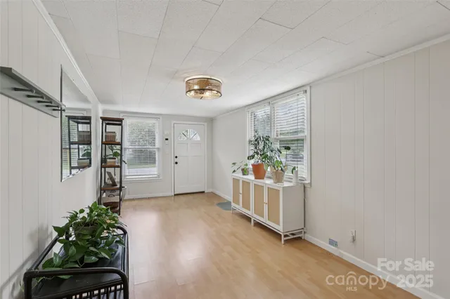a view of entryway with wooden floor