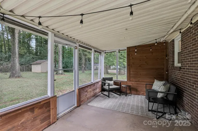 a patio with yard glass top table and chairs