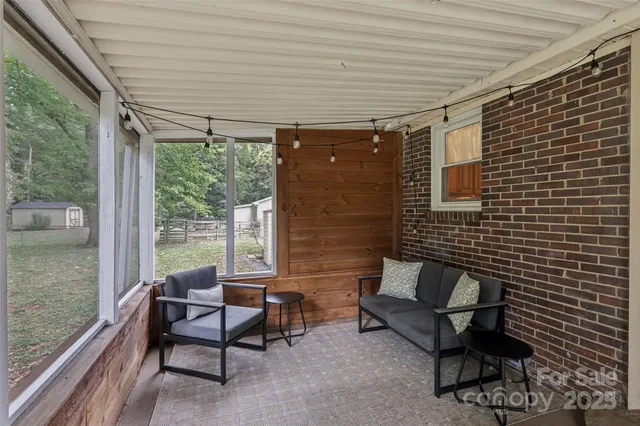 a outdoor living space with furniture and a potted plant