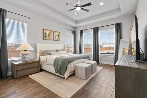 a spacious bathroom with a bathtub and a sink