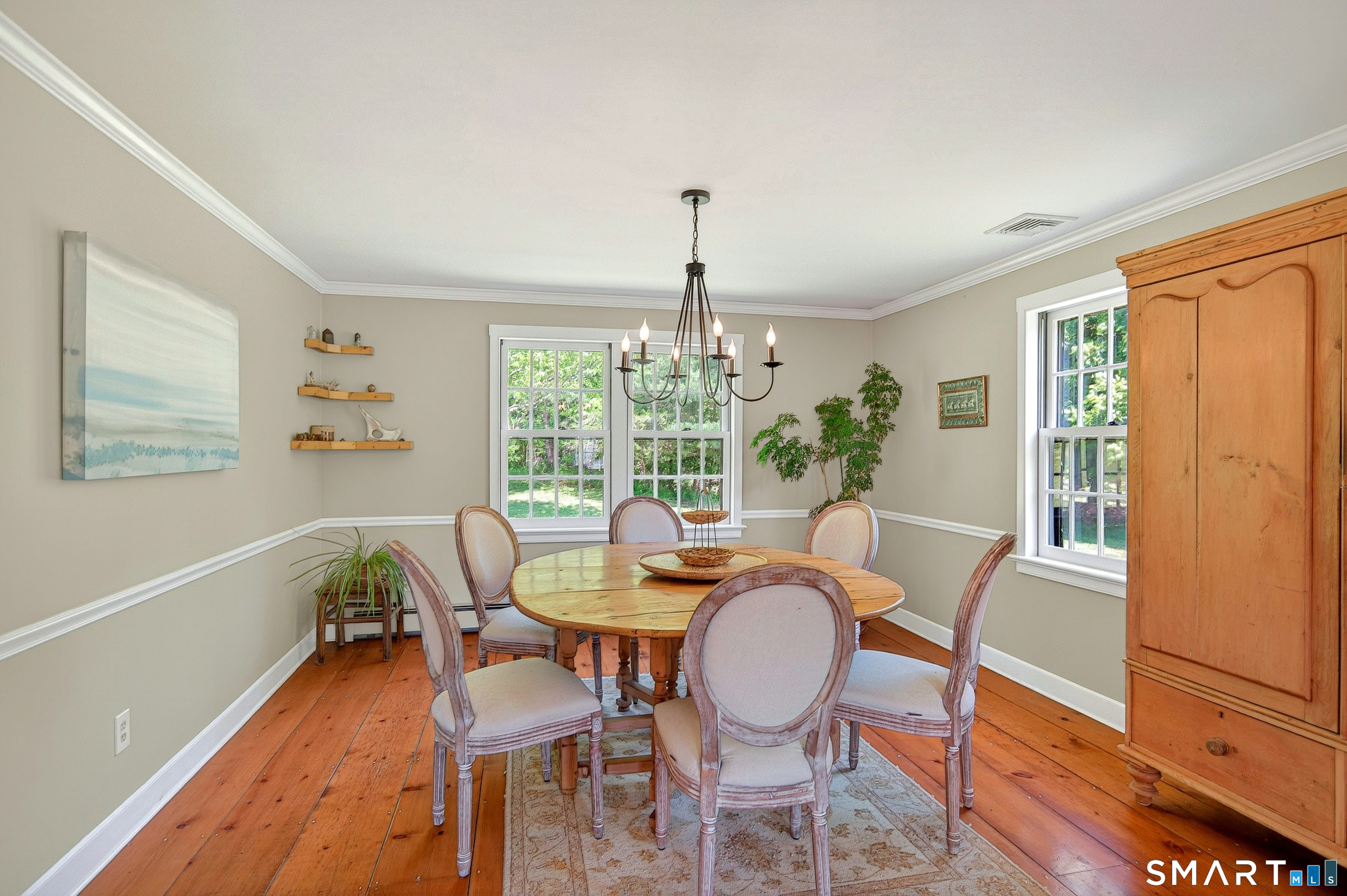 174 Huntingtown Road Newtown, CT 06470 - Photo 8 of 40 a dining room with furniture a chandelier and wooden floor
