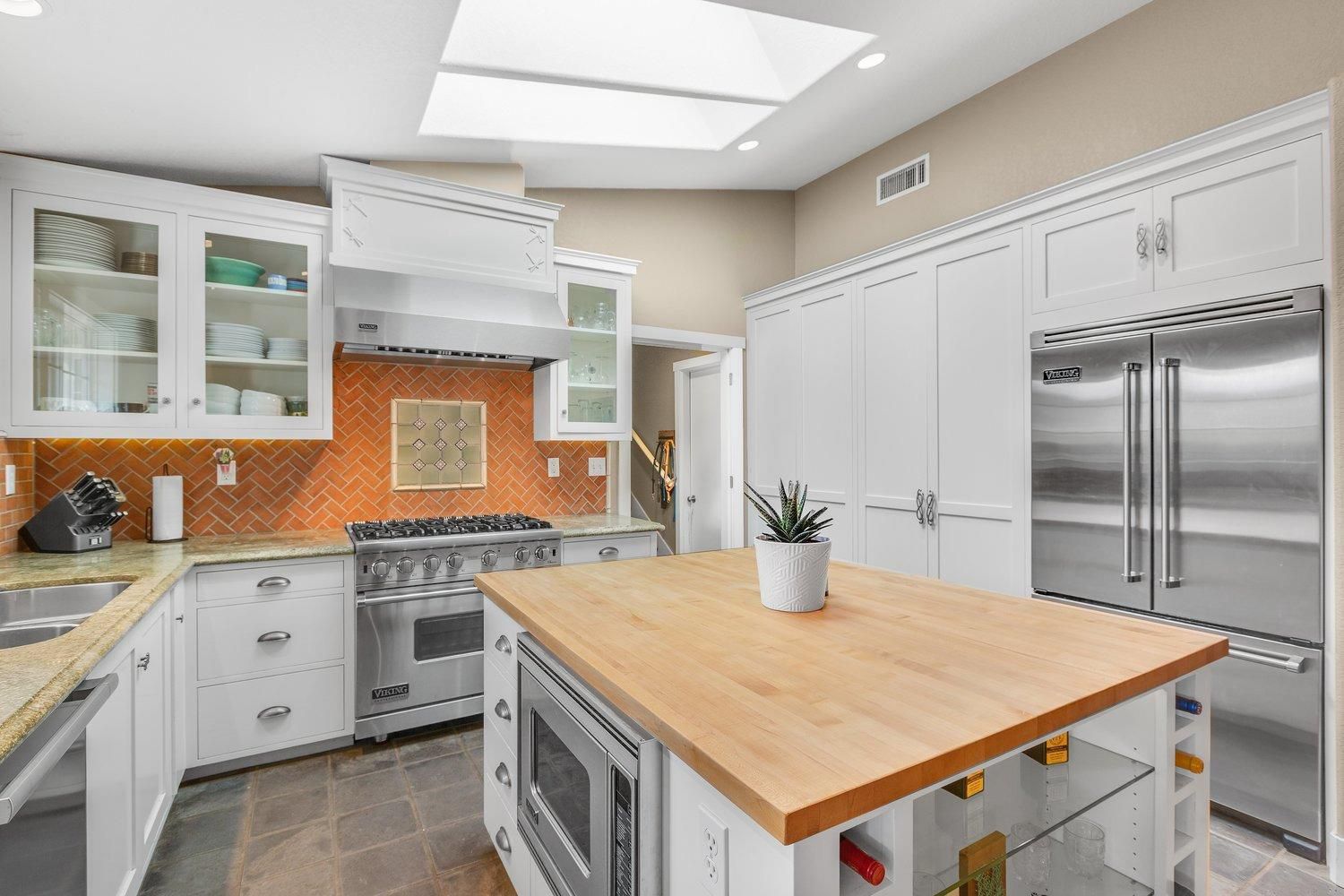 570 Burnham Road Oak View, CA 93022 - Photo 8 of 17 a kitchen with a stove a sink and a refrigerator