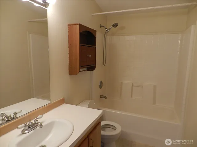 a view of backyard with garden and deck