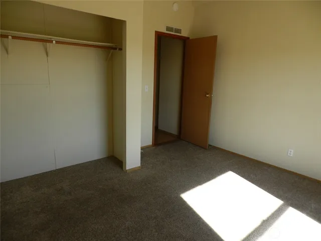 a bathroom with a shower and vanity