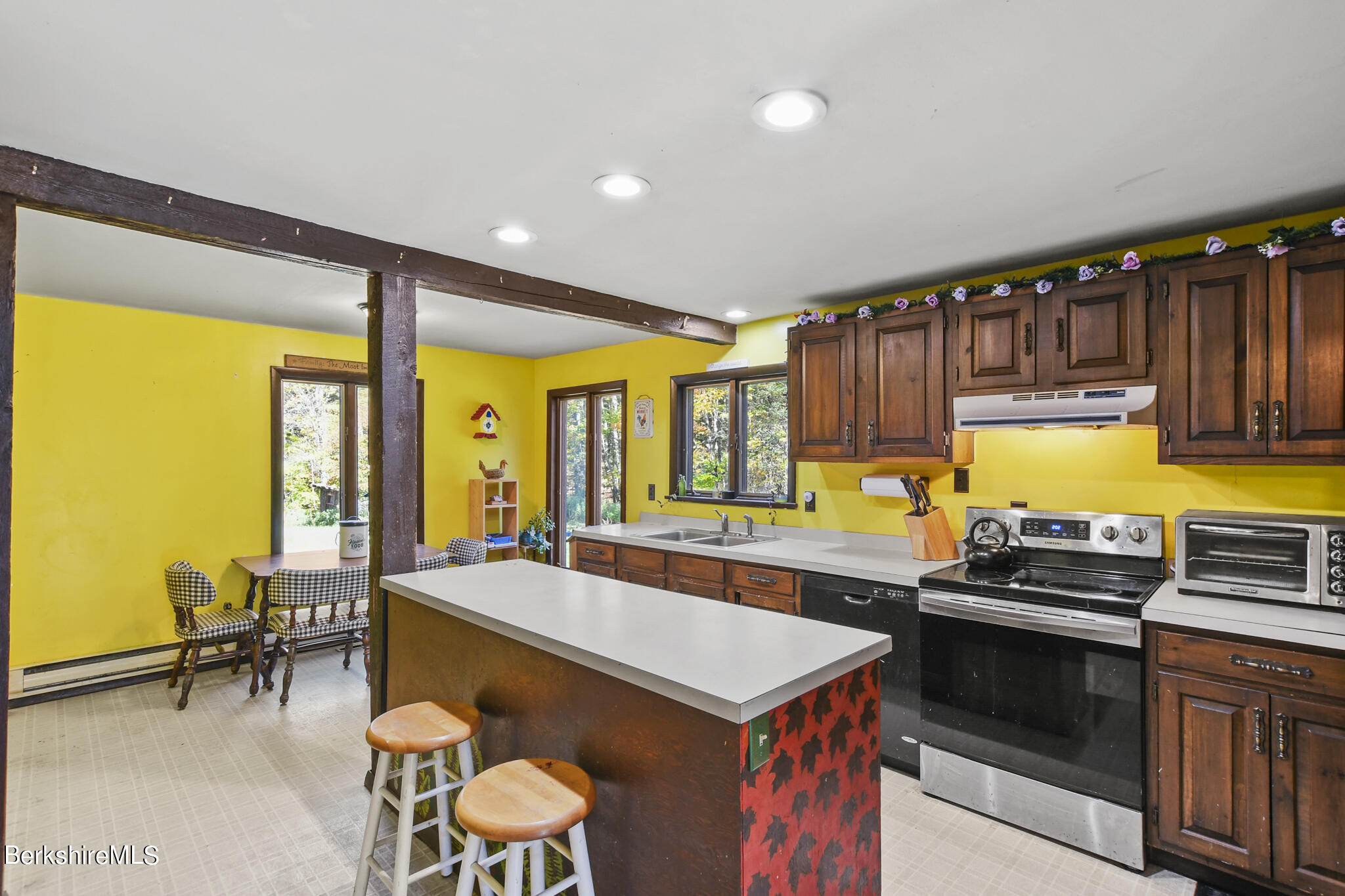 74 Old Main Road Savoy, MA 01256 - Photo 22 of 42 a kitchen with a sink stove and table