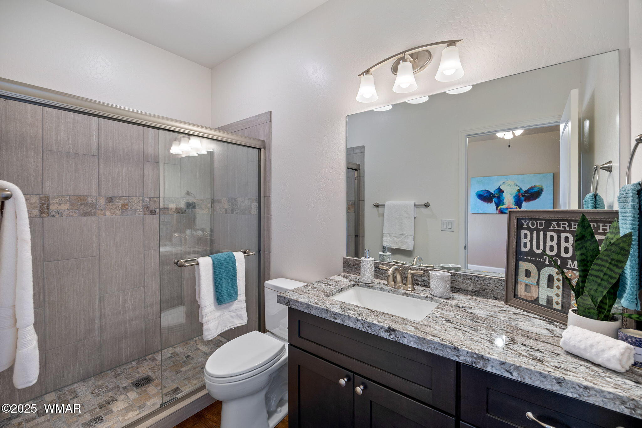 5523 Turkey Run Road Pinedale, AZ 85934 - Photo 15 of 34 a bathroom with a granite countertop sink toilet and shower