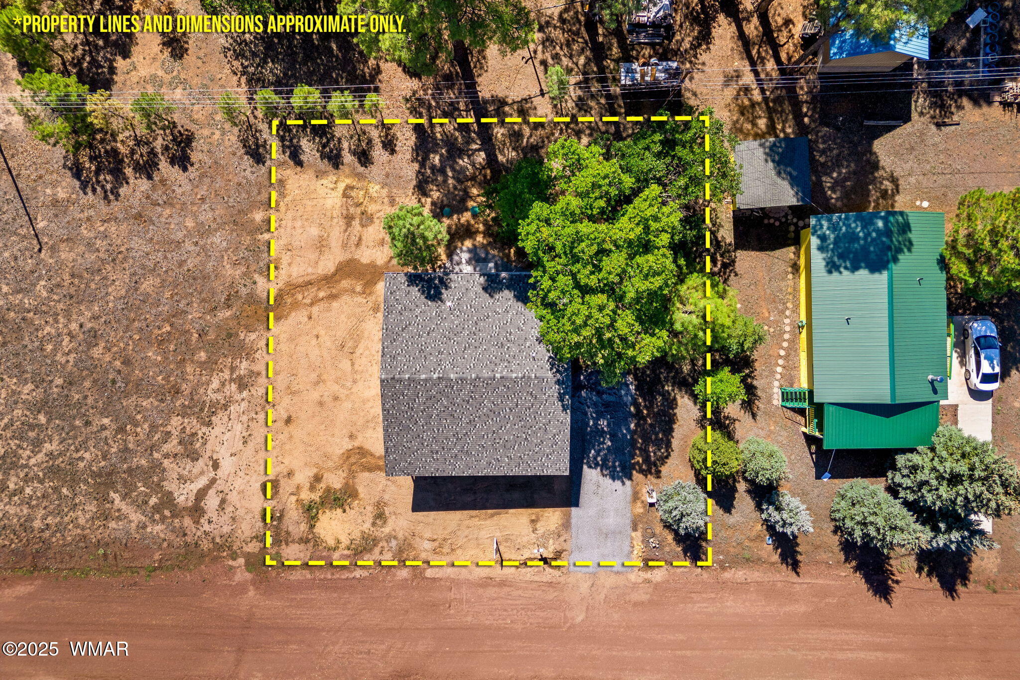 5523 Turkey Run Road Pinedale, AZ 85934 - Photo 26 of 34 an aerial view of a house with a yard and garden