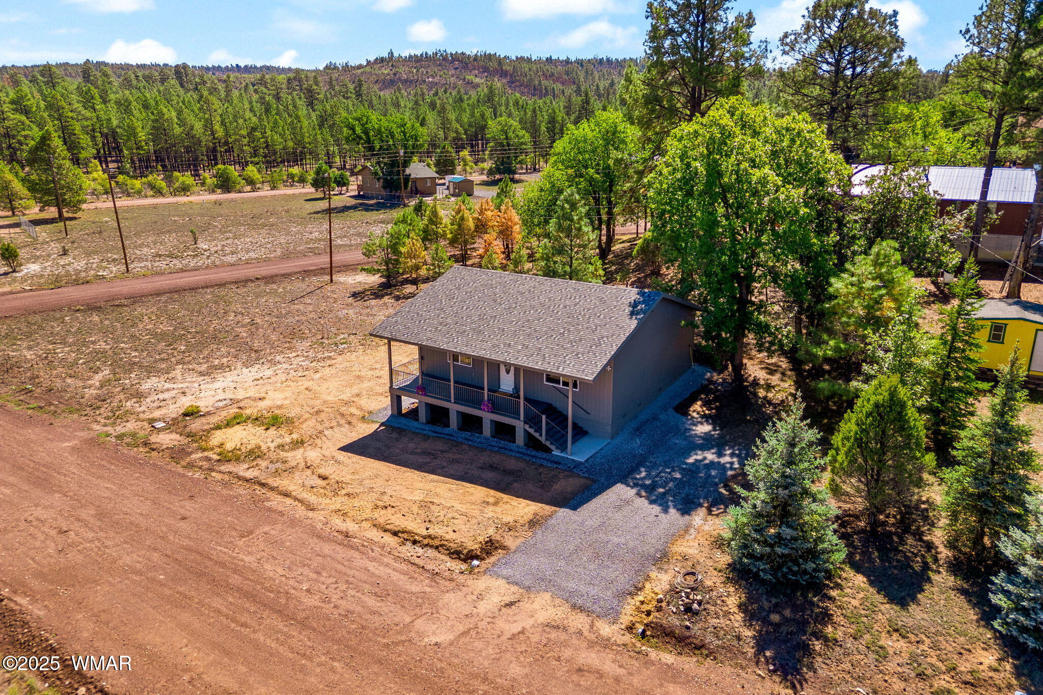 5523 Turkey Run Road Pinedale, AZ 85934 - Photo 27 of 34 a view of a terrace with a bench