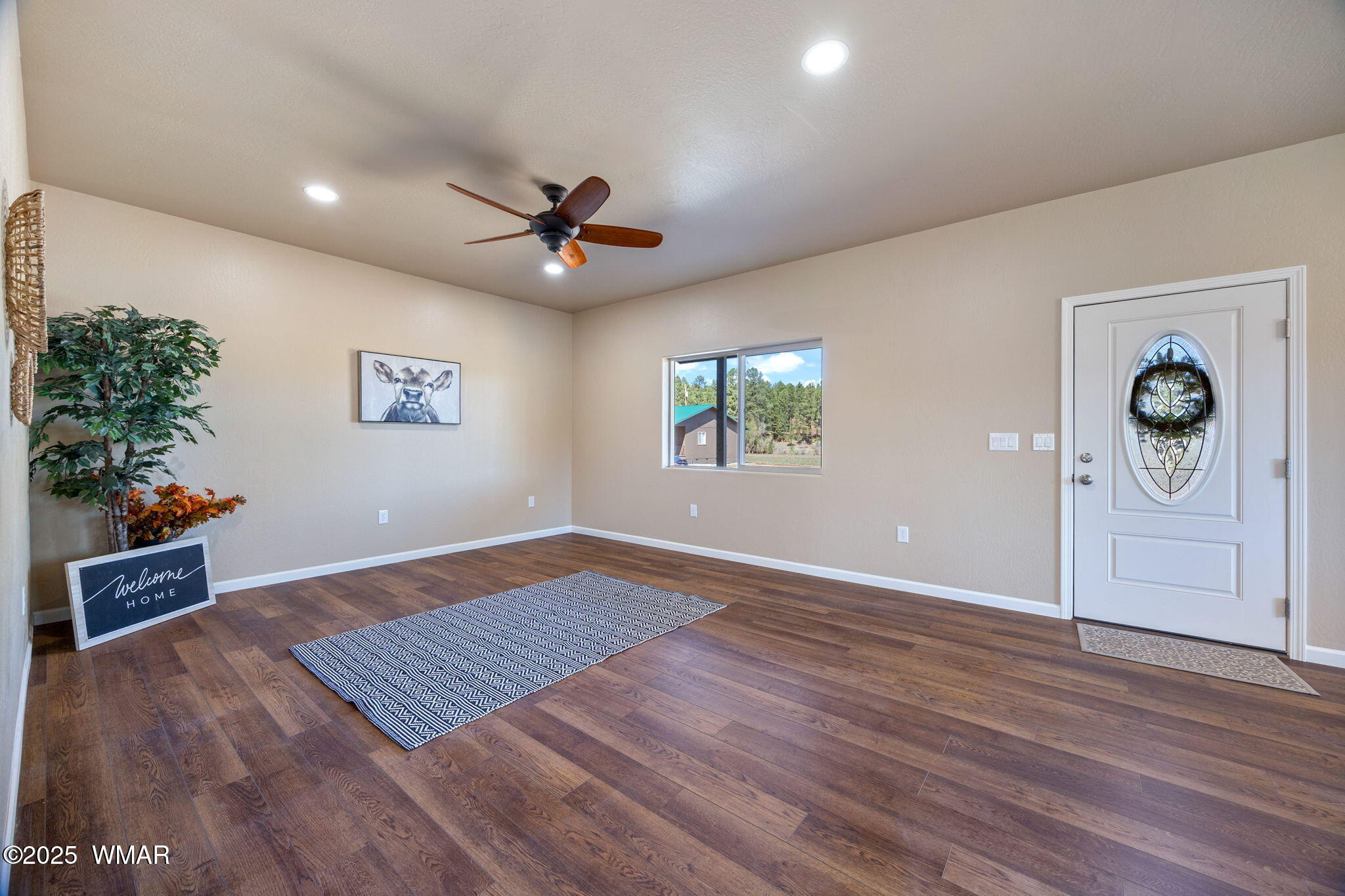 5523 Turkey Run Road Pinedale, AZ 85934 - Photo 7 of 34 wooden floor in an empty room with a window