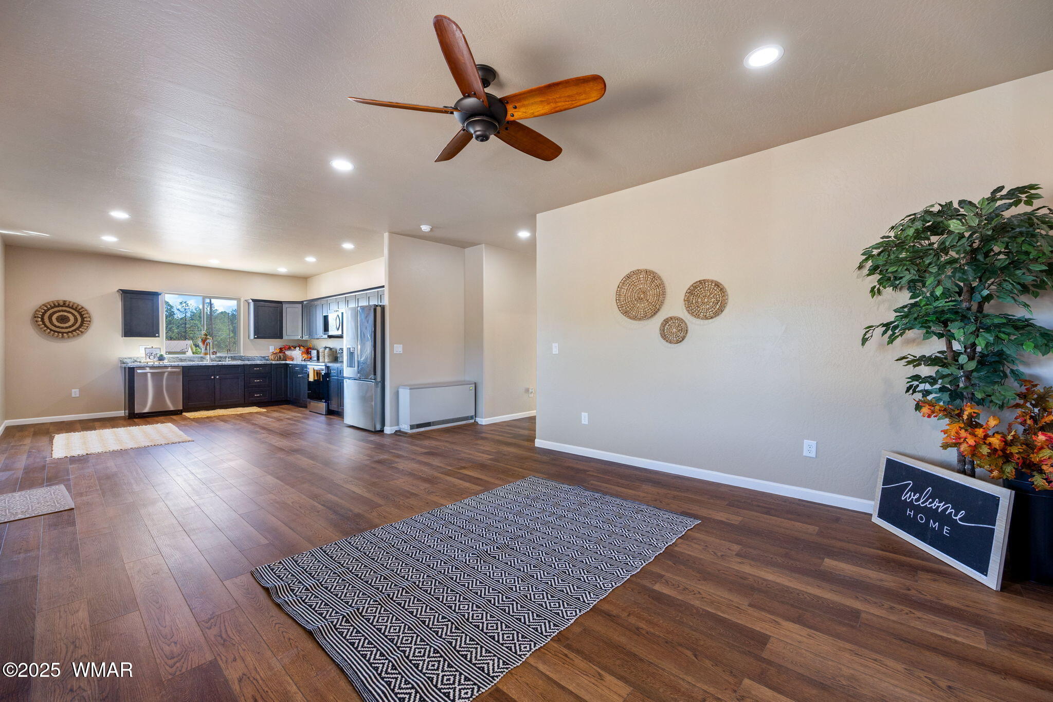 5523 Turkey Run Road Pinedale, AZ 85934 - Photo 8 of 34 a view of livingroom with hardwood floor and a ceiling fan