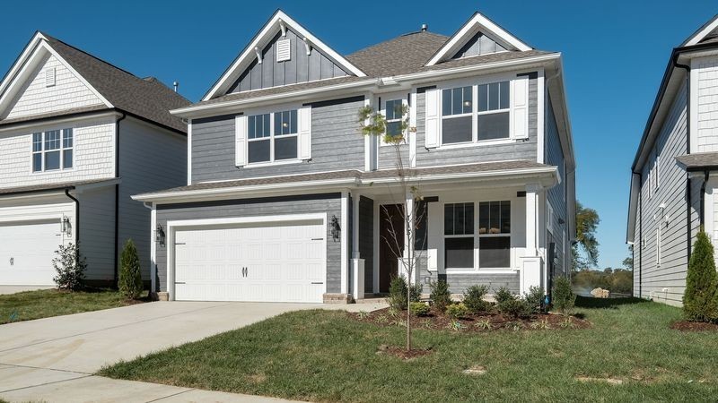 838 Sugarbush Lane Spring Hill, TN 37174 - Photo 2 of 26 a front view of a house with a yard