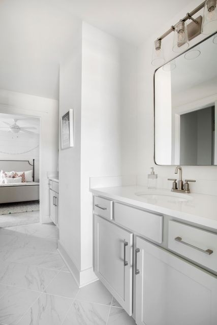 838 Sugarbush Lane Spring Hill, TN 37174 - Photo 22 of 26 a en suite bathroom with a sink and a mirror