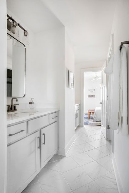 838 Sugarbush Lane Spring Hill, TN 37174 - Photo 23 of 26 a spacious bathroom with a shower sink and a mirror
