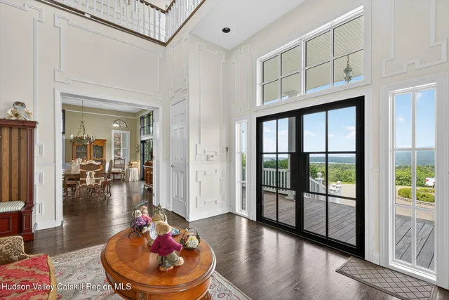 a lobby with furniture and floor to ceiling window