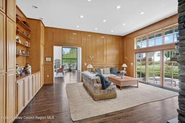 a view of a livingroom with furniture window and wooden floor