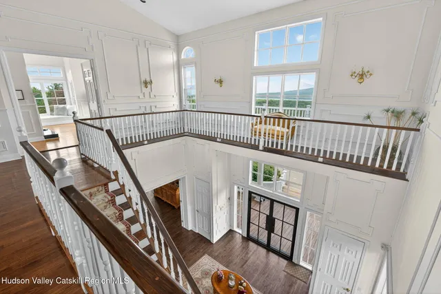 a living room with furniture and a bed