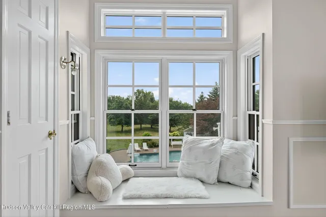 a view of a house with backyard porch and wooden floor