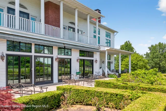 a bedroom with a bed and chair
