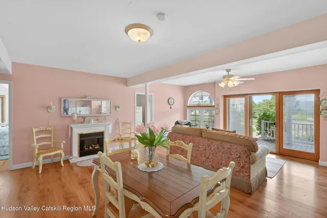 a dining room with furniture a chandelier and window
