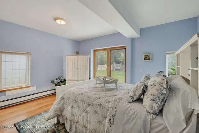 a view of a backyard with large trees