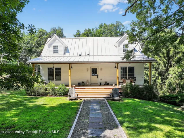 an aerial view of a house with a garden