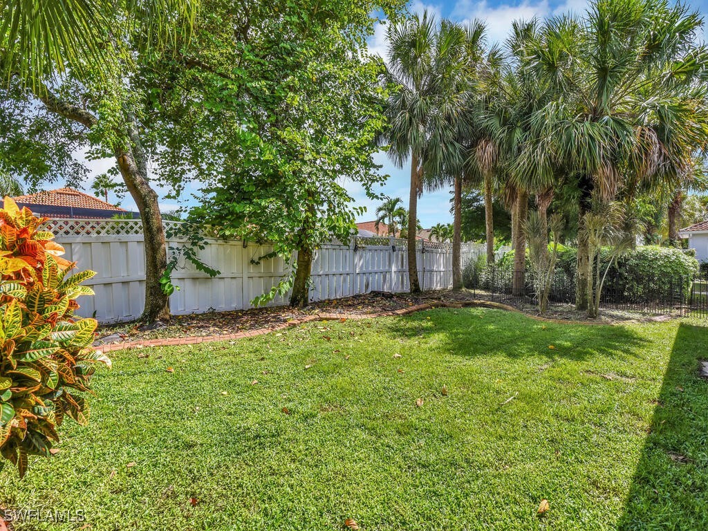 12886 Timber Ridge Drive Fort Myers, FL 33913 - Photo 23 of 24 a backyard of a house with lots of green space