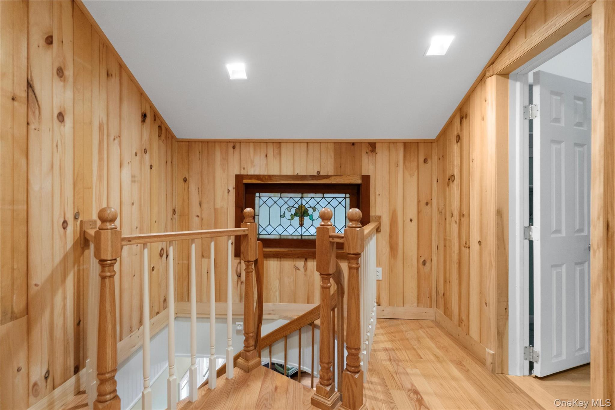 1081 East Mountain Road South Cold Spring, NY 10516 - Photo 33 of 50 Spiral staircase landing with stained glass window. Note door leads to upper level bedroom.