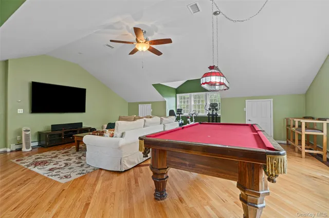 a view of a house with a yard deck and sitting area