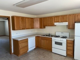 788 Highview Drive, Unit 2 Antioch, IL 60002 - Photo 2 of 13 a kitchen with a stove sink and cabinets