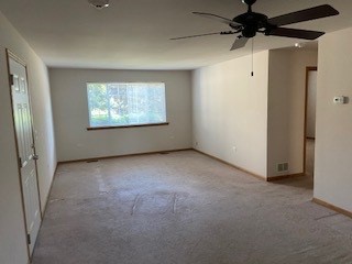 788 Highview Drive, Unit 2 Antioch, IL 60002 - Photo 3 of 13 wooden floor in an empty room with a window