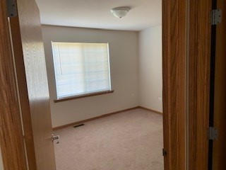 788 Highview Drive, Unit 2 Antioch, IL 60002 - Photo 4 of 13 an empty room with windows