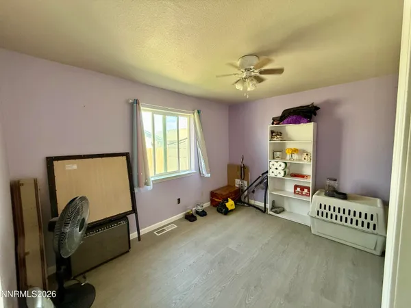 a room with gym equipment and a window