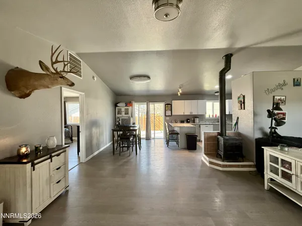 a view of a livingroom with furniture and a flat screen tv