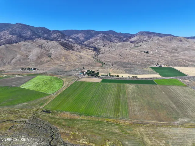 a view of a mountain with a mountain in the background