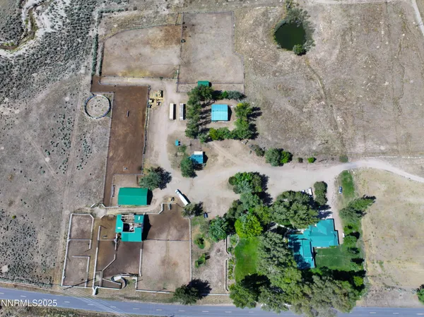 a view of a swimming pool and lounge chairs