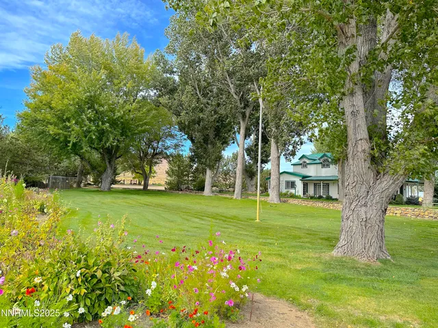 a front view of a house with a garden and porch